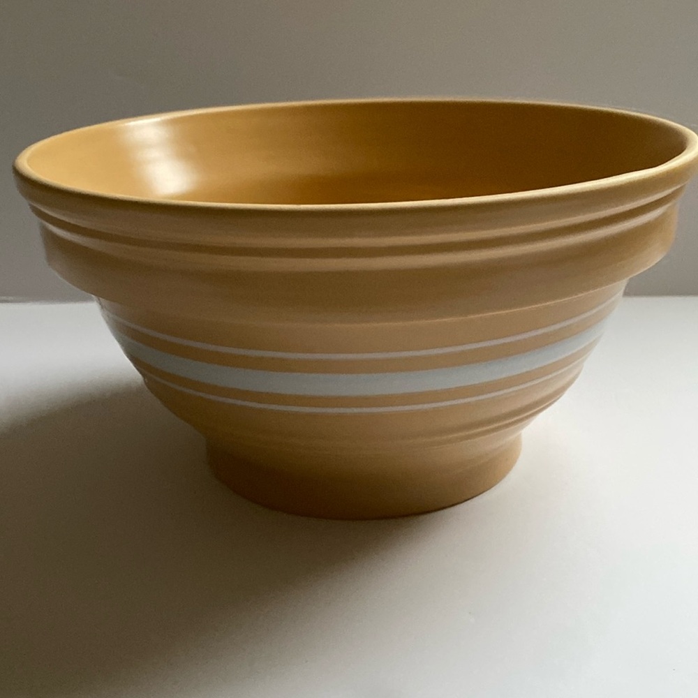Stonewall Kitchen  yellow ware pottery mixing bowl with white stripe.